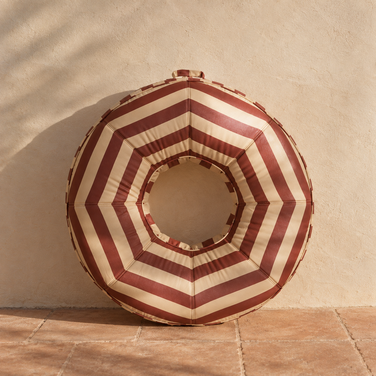The Rondo striped canvas-covered inflatable pool ring