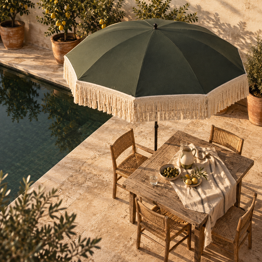The Sorrento deep olive garden parasol with cream macrame fringe